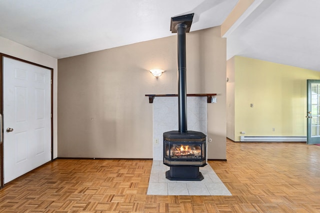 unfurnished living room with a wood stove and baseboard heating
