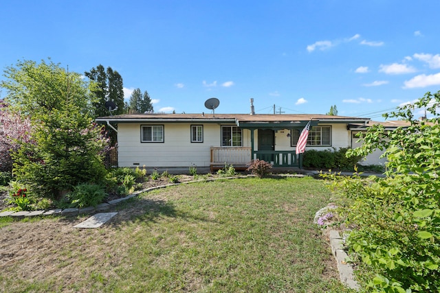 ranch-style home with a porch and a front lawn