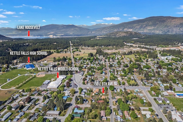 aerial view of property's location with a mountain backdrop