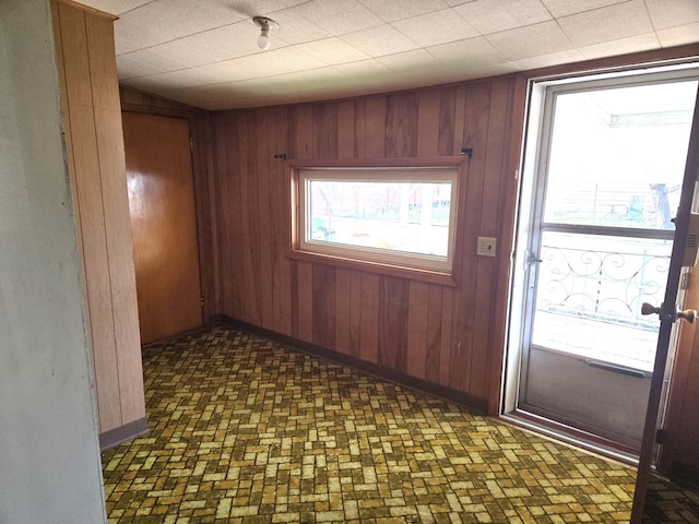 901 N 3rd St E, Chewelah, WA 99109 - spare room featuring wood walls and baseboards
