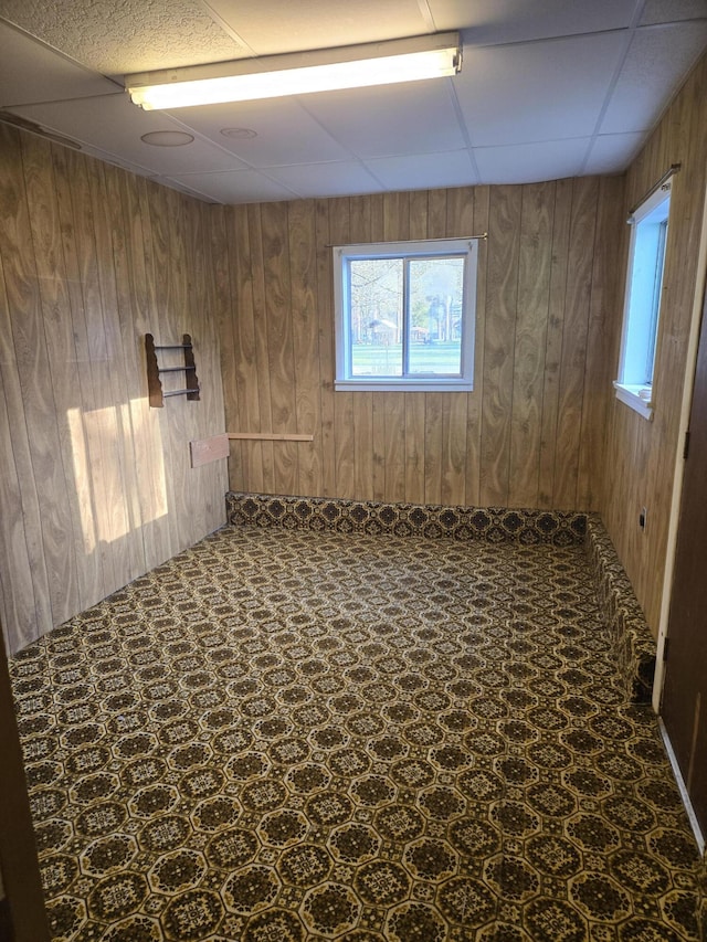 901 N 3rd St E, Chewelah, WA 99109 - spare room featuring wooden walls and a paneled ceiling