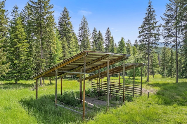 view of home's community featuring an outbuilding