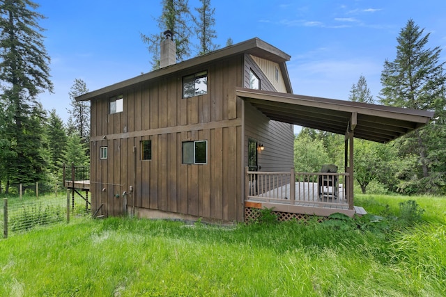 view of side of home featuring a deck