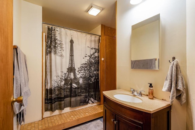 bathroom featuring vanity and a shower with shower curtain