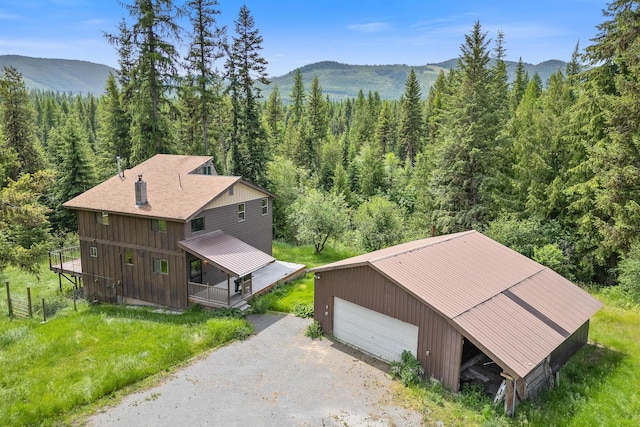 birds eye view of property featuring a mountain view