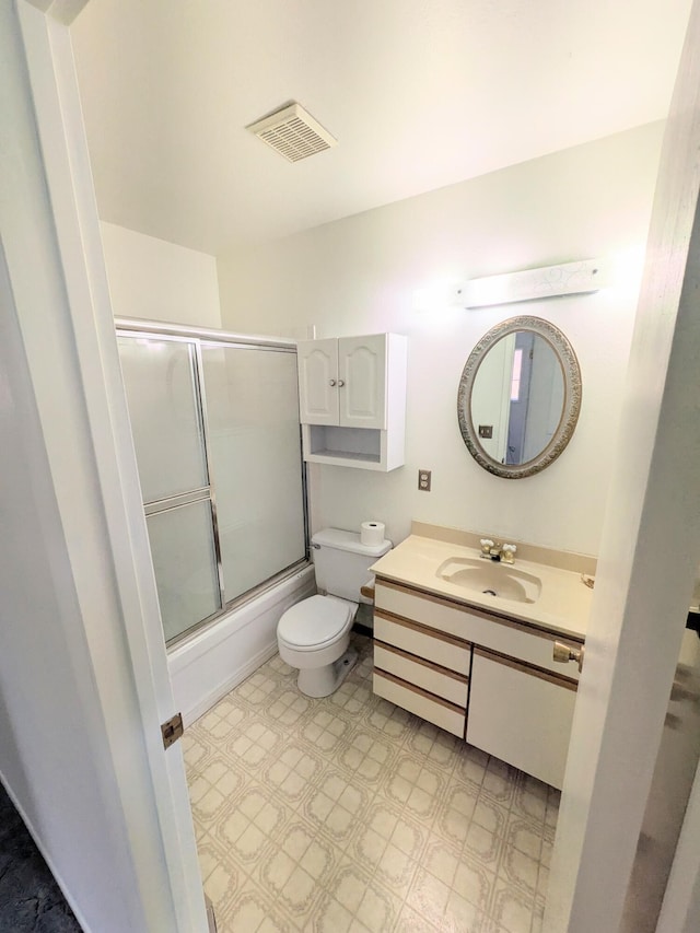 1262 E Elep Ave, Colville, WA 99114 - bathroom with toilet, vanity, shower / bath combination with glass door, and tile patterned floors