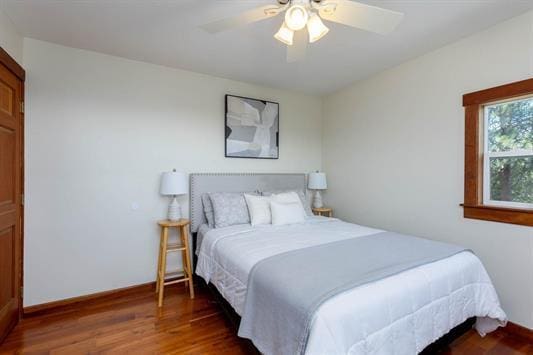 3439 Northport Flat Creek Rd Unit B, Kettle Falls, WA 99141 - bedroom with wood finished floors, baseboards, and a ceiling fan