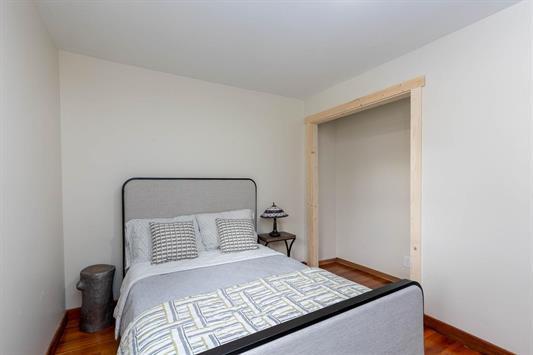 3439 Northport Flat Creek Rd Unit B, Kettle Falls, WA 99141 - bedroom with wood finished floors and baseboards
