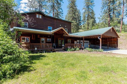 3439 Northport Flat Creek Rd Unit B, Kettle Falls, WA 99141 - view of front of home with a front yard, covered porch, and driveway