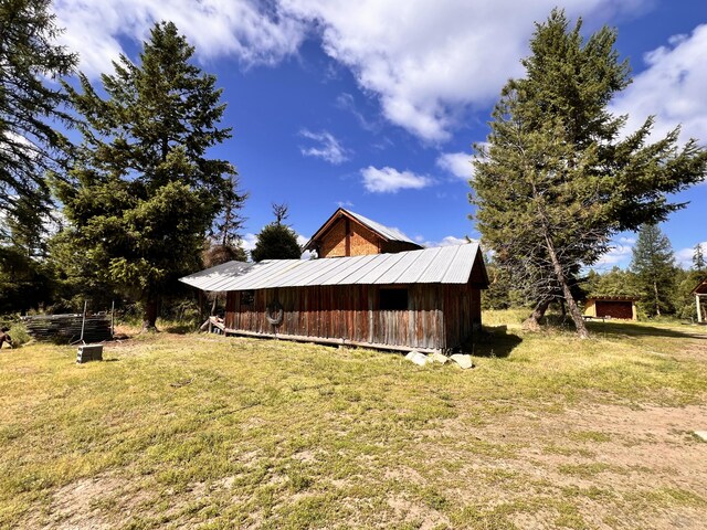 177 First Creek Rd, Curlew, WA 99118 - view of home's exterior featuring a yard and an outdoor structure