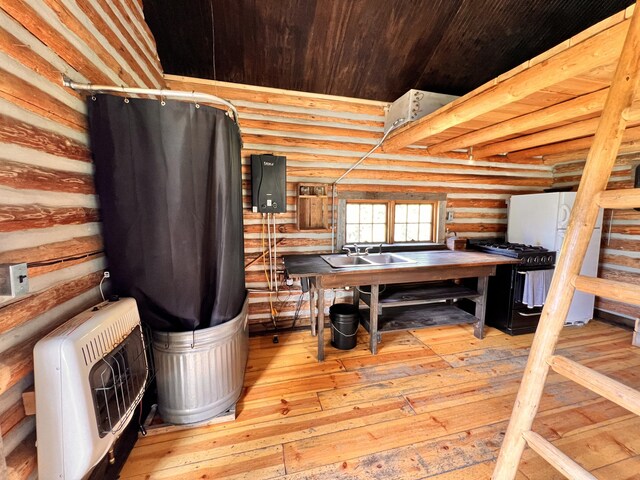 177 First Creek Rd, Curlew, WA 99118 - misc room featuring wood ceiling, rustic walls, sink, heating unit, and light hardwood / wood-style flooring