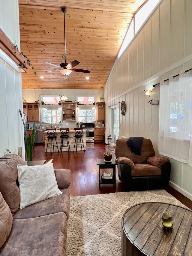 living area featuring wood ceiling, high vaulted ceiling, a ceiling fan, and dark wood-style floors
