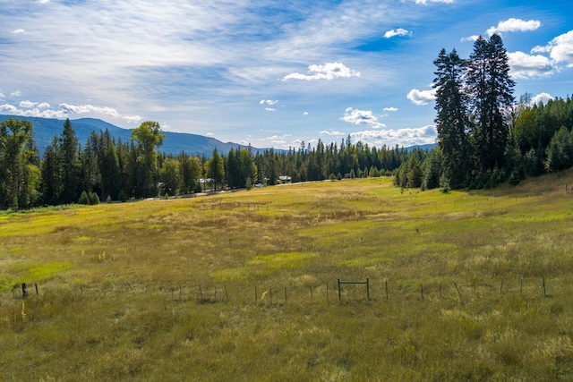 mountain view featuring a rural view