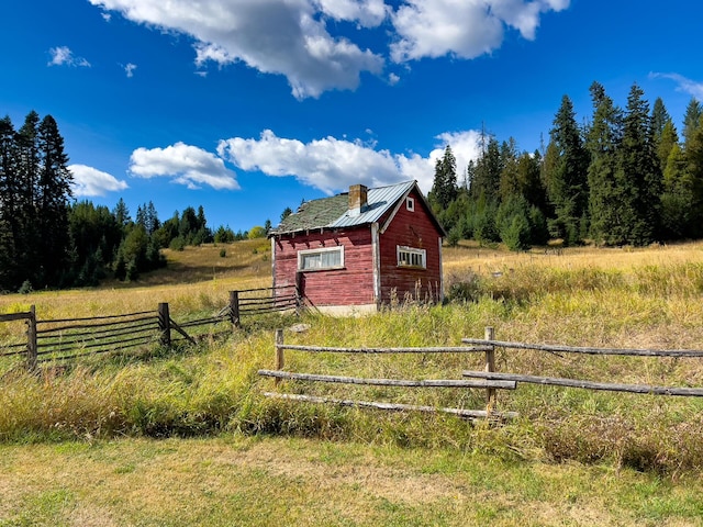 view of outbuilding featuring a rural view