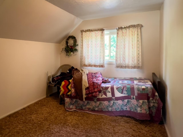 carpeted bedroom featuring vaulted ceiling