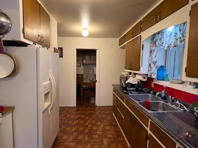 1873 Greenhouse Rd, Ione, WA 99139 - kitchen featuring sink, dark parquet floors, and white refrigerator with ice dispenser