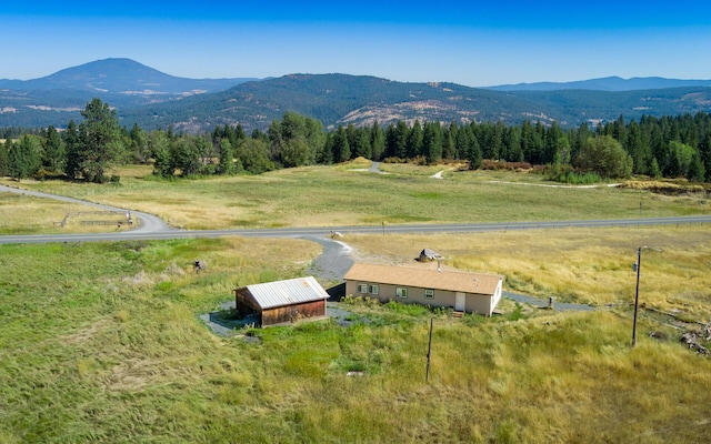 bird's eye view featuring a rural view and a mountain view