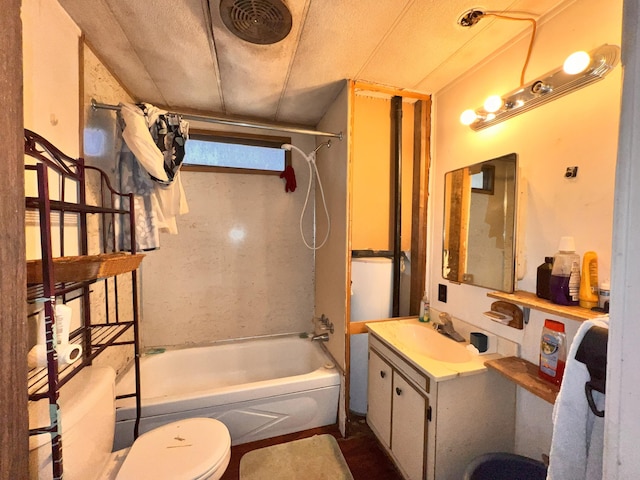 full bathroom with vanity,  shower combination, a textured ceiling, and toilet