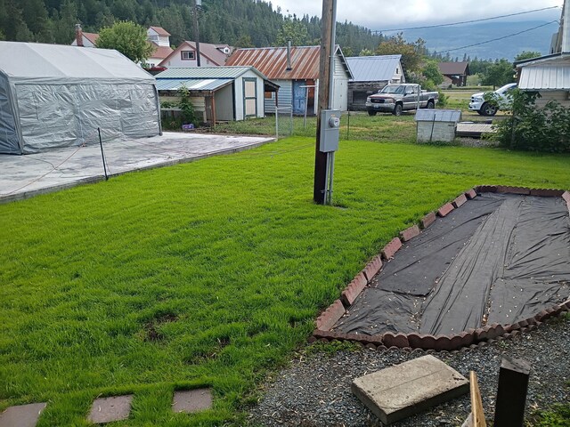 1208 Overlook Blvd, Marcus, WA 99151 - view of grassy yard with an outbuilding