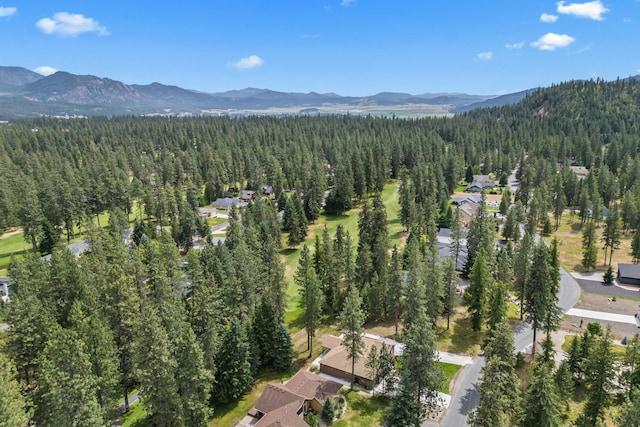 231 Hogans Way, Chewelah, WA 99109 - aerial overview of property's location with a heavily wooded area and a mountainous background