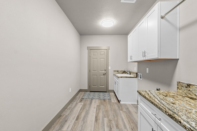 231 Hogans Way, Chewelah, WA 99109 - washroom with cabinet space, washer hookup, and light wood-style floors