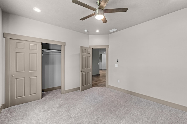 231 Hogans Way, Chewelah, WA 99109 - unfurnished bedroom featuring carpet, a closet, recessed lighting, and a ceiling fan