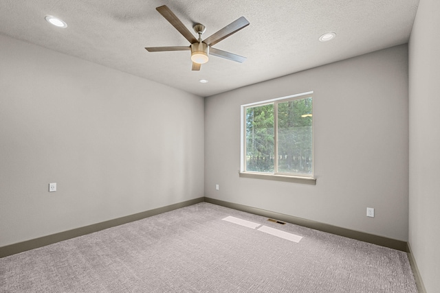231 Hogans Way, Chewelah, WA 99109 - spare room featuring carpet flooring, ceiling fan, a textured ceiling, and recessed lighting