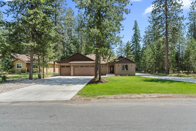 231 Hogans Way, Chewelah, WA 99109 - view of front of home with an attached garage, driveway, and a front lawn