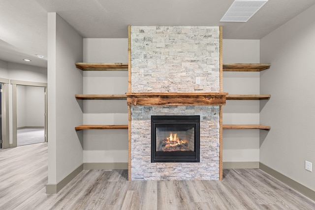 231 Hogans Way, Chewelah, WA 99109 - detailed view of wood finished floors, a fireplace, and recessed lighting