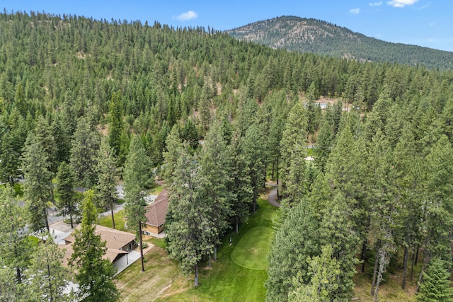 231 Hogans Way, Chewelah, WA 99109 - aerial overview of property's location featuring a heavily wooded area and mountains