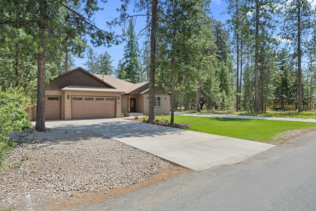 231 Hogans Way, Chewelah, WA 99109 - view of front of property with a garage, driveway, and a front lawn