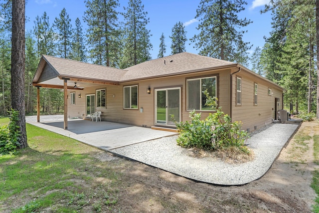 231 Hogans Way, Chewelah, WA 99109 - back of property featuring ceiling fan, a patio area, crawl space, and roof with shingles