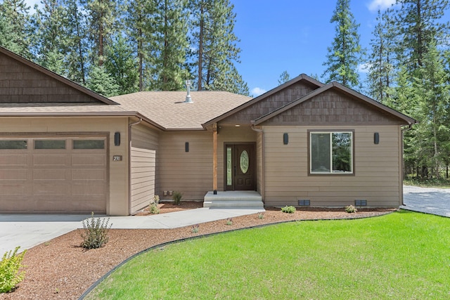 231 Hogans Way, Chewelah, WA 99109 - view of front of house featuring driveway, a garage, roof with shingles, and a front lawn