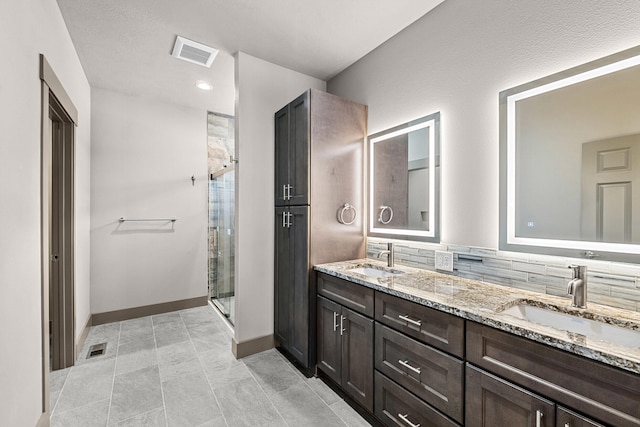 231 Hogans Way, Chewelah, WA 99109 - bathroom featuring double vanity and a stall shower