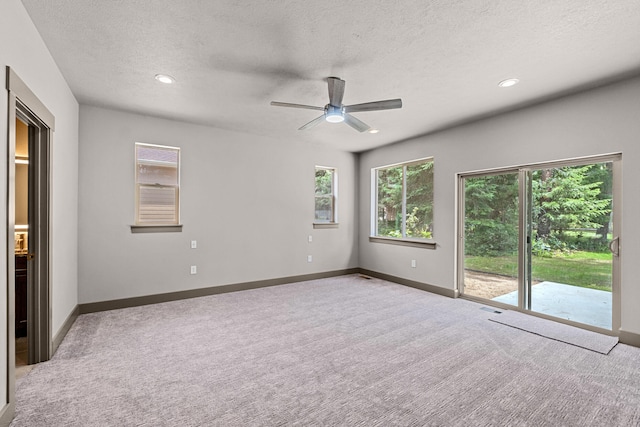 231 Hogans Way, Chewelah, WA 99109 - spare room featuring light carpet, ceiling fan, a textured ceiling, and recessed lighting