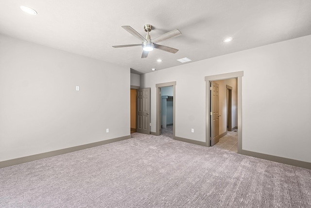 231 Hogans Way, Chewelah, WA 99109 - unfurnished bedroom featuring light carpet, recessed lighting, a walk in closet, a ceiling fan, and ensuite bath