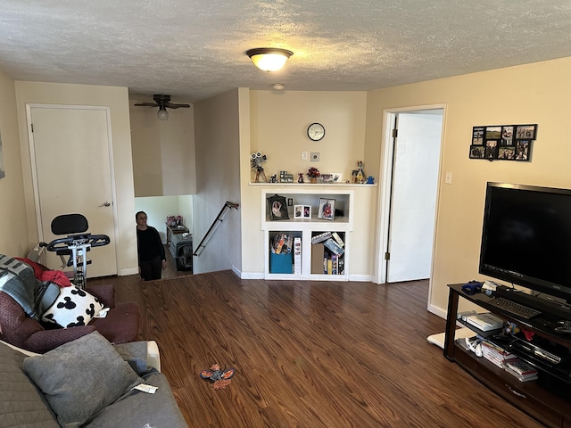 1016 E 3rd Ave, Colville, WA 99114 - living area featuring wood finished floors, a textured ceiling, baseboards, and a ceiling fan