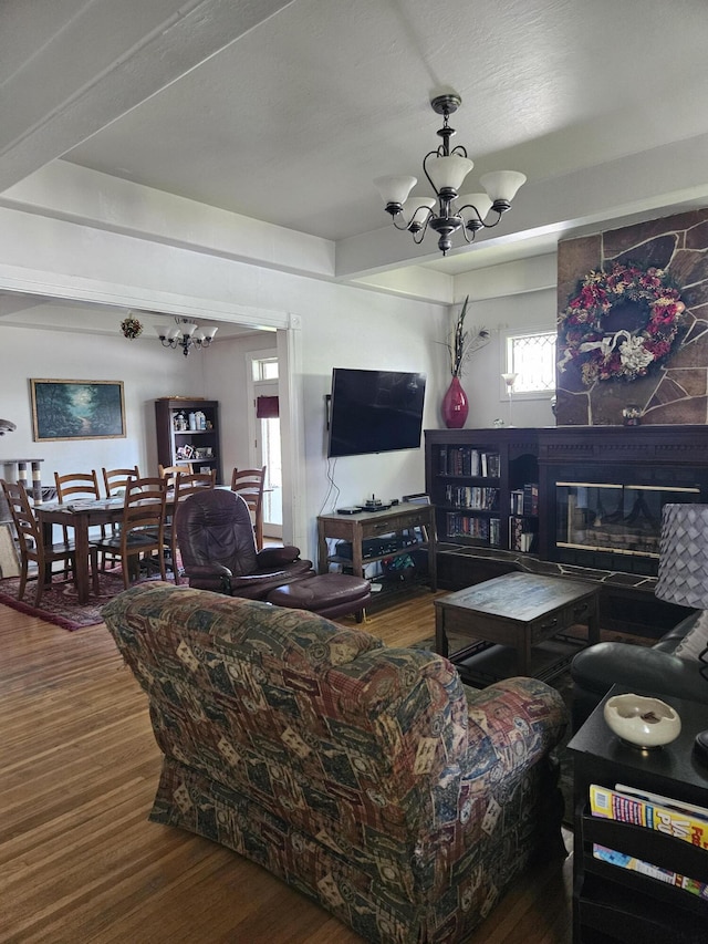 453 E Astor Ave, Colville, WA 99114 - living room with a fireplace, a chandelier, and wood finished floors
