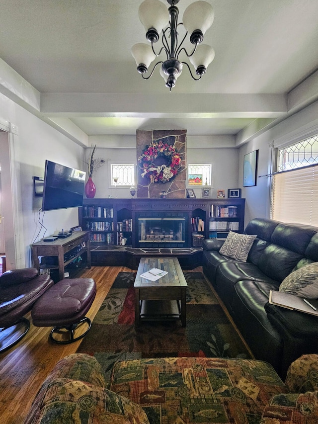 453 E Astor Ave, Colville, WA 99114 - living area featuring an inviting chandelier, a large fireplace, and wood finished floors