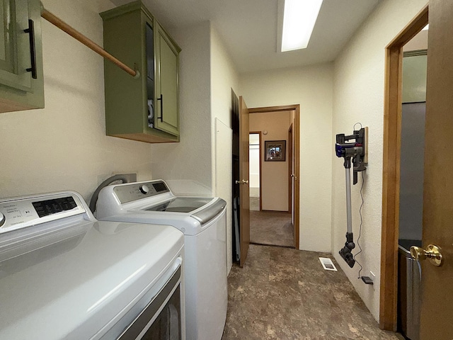 49 Sandpiper Way, Republic, WA 99166 - laundry area with cabinet space and washing machine and clothes dryer