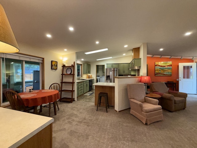 49 Sandpiper Way, Republic, WA 99166 - living area with light carpet, recessed lighting, lofted ceiling, and track lighting