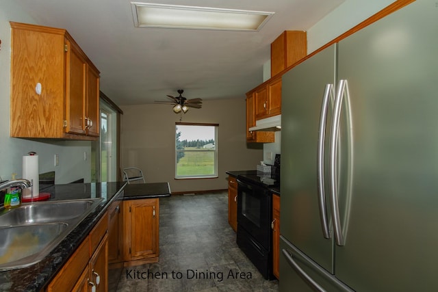 40009 N Sherman Rd, Deer Park, WA 99006 - kitchen with freestanding refrigerator, black electric range oven, a sink, and brown cabinetry