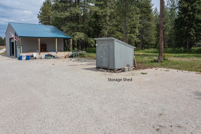 40009 N Sherman Rd, Deer Park, WA 99006 - view of yard featuring an outbuilding, a storage unit, and a garage