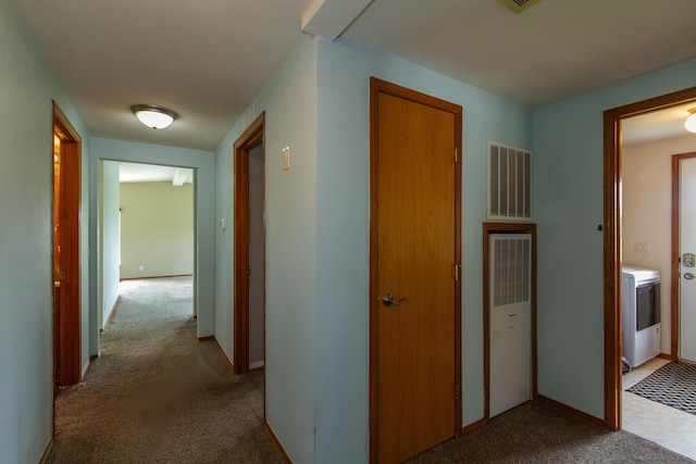 40009 N Sherman Rd, Deer Park, WA 99006 - corridor featuring a heating unit, washer / dryer, carpet floors, and baseboards