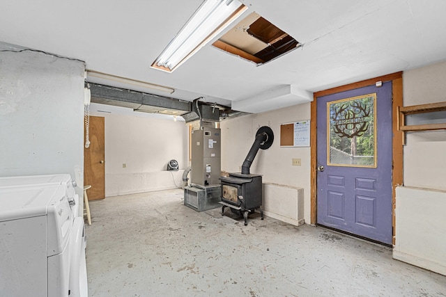 2184 Clugston Onion Creek Rd, Colville, WA 99114 - basement featuring a wood stove, washing machine and dryer, and heating unit