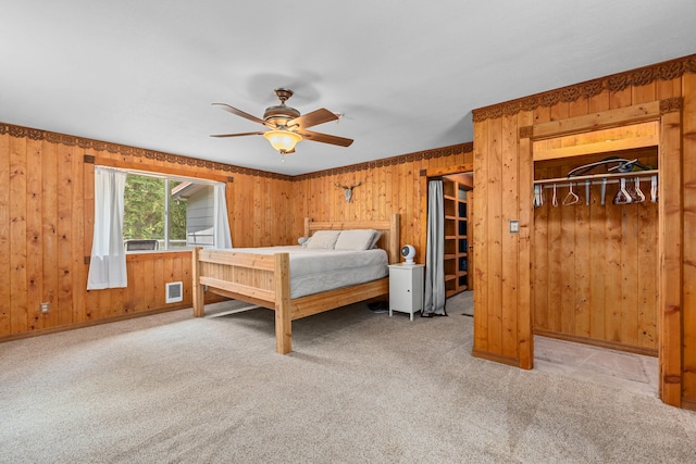 2184 Clugston Onion Creek Rd, Colville, WA 99114 - carpeted bedroom with wood walls and a ceiling fan
