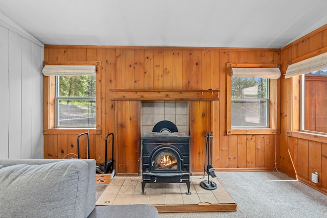 2184 Clugston Onion Creek Rd, Colville, WA 99114 - living room featuring a wood stove, wooden walls, and carpet