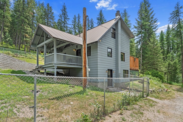 2184 Clugston Onion Creek Rd, Colville, WA 99114 - view of side of home featuring a metal roof and a chimney