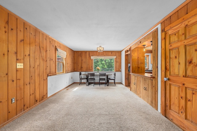 2184 Clugston Onion Creek Rd, Colville, WA 99114 - dining room with light colored carpet and wooden walls