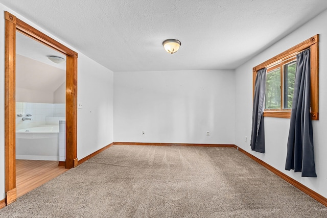 2184 Clugston Onion Creek Rd, Colville, WA 99114 - carpeted empty room with a textured ceiling and baseboards